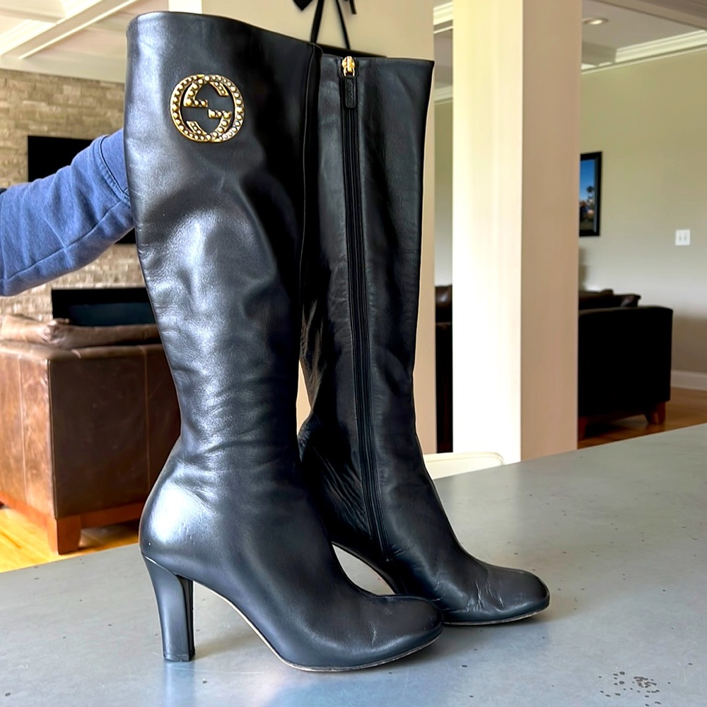 Gucci knee high black leather boots with antique gold Gucci logo